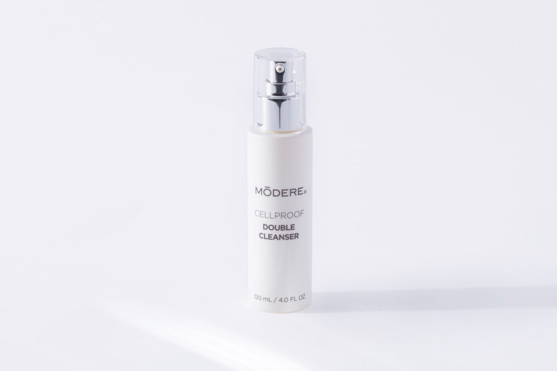 A bottle of Modere CellProof Double Cleanser